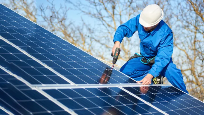 Solar panels being installed on a rooftop